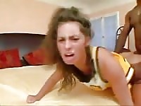 Sexy brunette cheerleader goes insane with a big black cock in her pussy