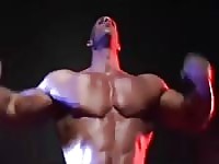 Huge bodybuilder showing off on stage