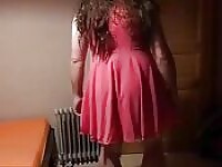 Sissy in pink dress strokes her big cock cock with